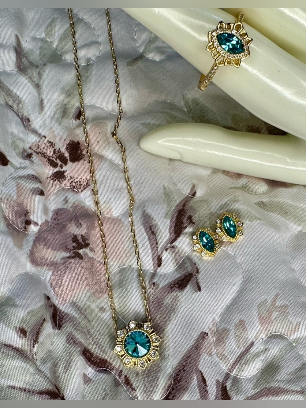 Fragrant Jewels Gold Necklace, Ring, and earrings with Teal Blue Crystal Pendant